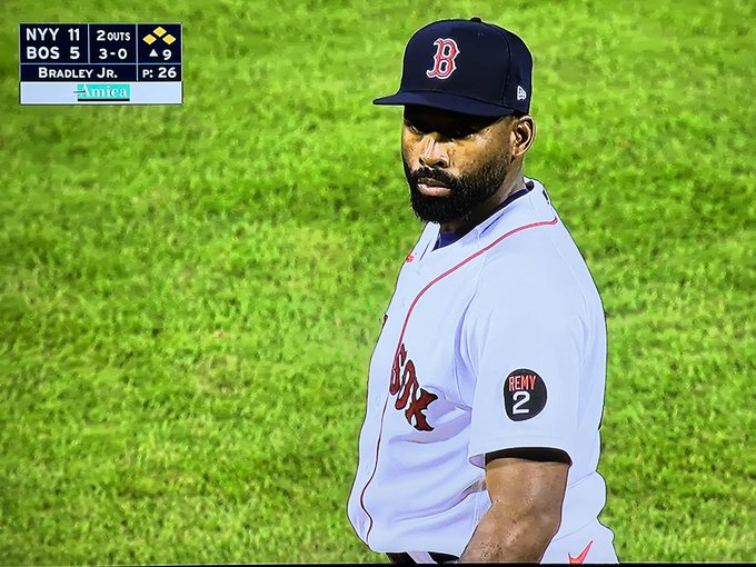 Jackie Bradley Jr. #19 of the Boston Red Sox looses his hat as he